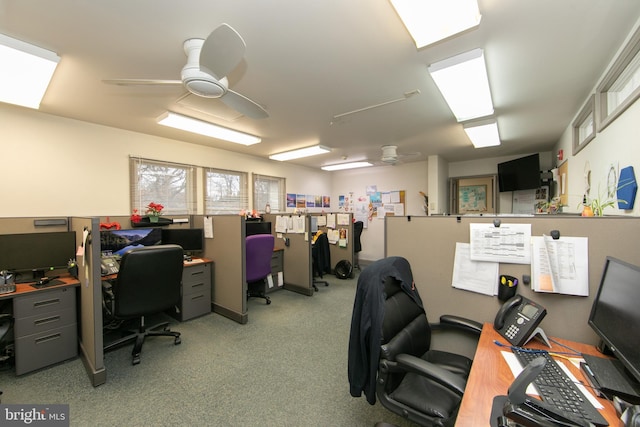 home office with light carpet and a ceiling fan