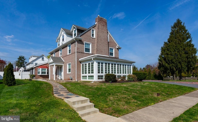 538 Gainsboro Rd, Drexel Hill, PA 19026 - exterior space featuring brick siding, a front lawn, and a chimney