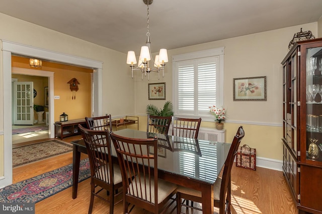 538 Gainsboro Rd, Drexel Hill, PA 19026 - dining room featuring a chandelier and wood finished floors