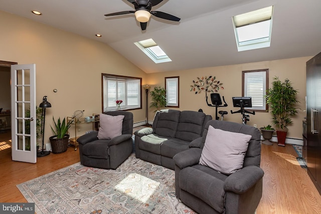 538 Gainsboro Rd, Drexel Hill, PA 19026 - living area featuring vaulted ceiling with skylight, ceiling fan, plenty of natural light, and wood finished floors