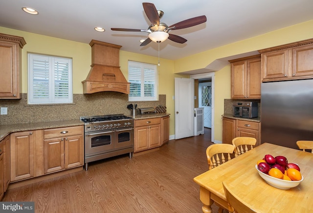 538 Gainsboro Rd, Drexel Hill, PA 19026 - kitchen featuring custom exhaust hood, ceiling fan, backsplash, and stainless steel appliances