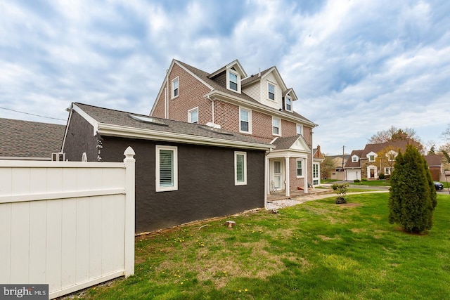 538 Gainsboro Rd, Drexel Hill, PA 19026 - view of side of home with a yard, brick siding, and roof with shingles