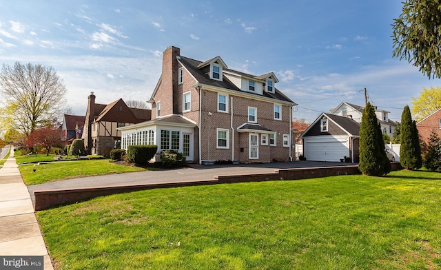 538 Gainsboro Rd, Drexel Hill, PA 19026 - view of front of home with a garage, brick siding, and a front lawn