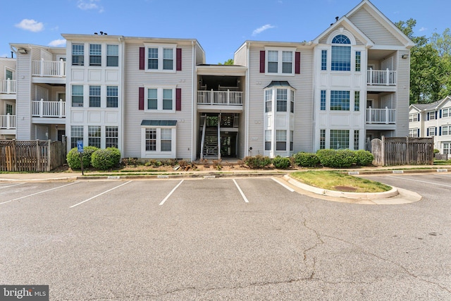 view of building exterior featuring uncovered parking