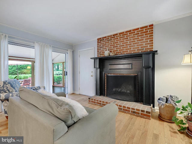 506 Devonshire Ln, Severna Park, MD 21146 - living area with ornamental molding, a brick fireplace, and wood finished floors