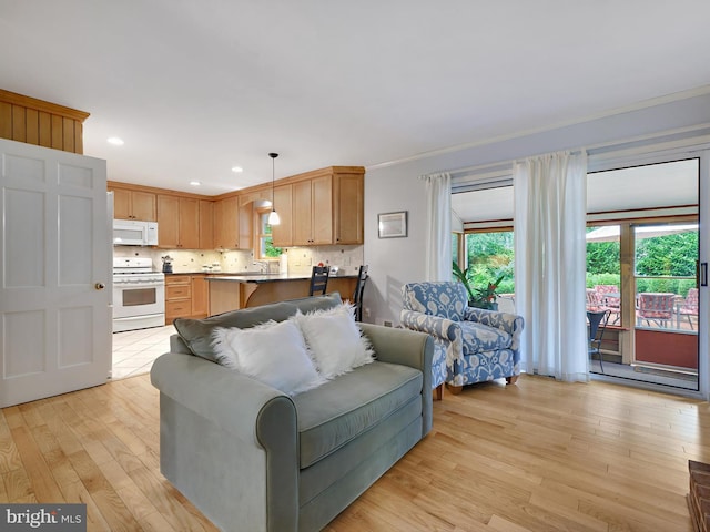 506 Devonshire Ln, Severna Park, MD 21146 - living room with healthy amount of natural light, light wood finished floors, recessed lighting, and ornamental molding