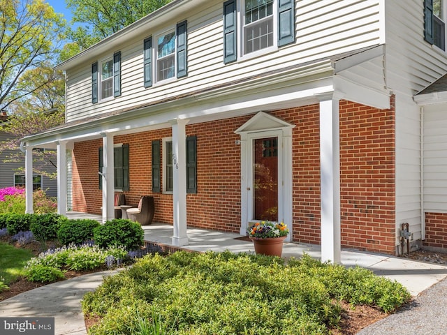 506 Devonshire Ln, Severna Park, MD 21146 - view of exterior entry with brick siding and covered porch