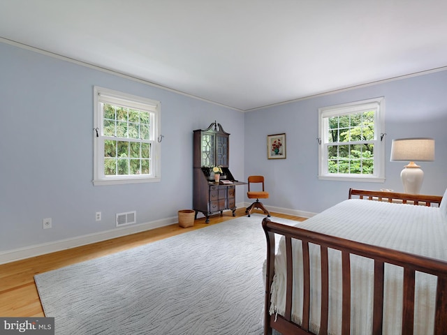 506 Devonshire Ln, Severna Park, MD 21146 - bedroom with wood finished floors, multiple windows, and crown molding