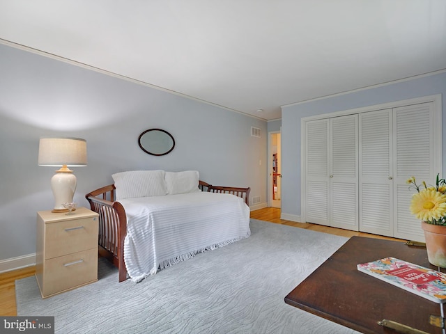 506 Devonshire Ln, Severna Park, MD 21146 - bedroom with a closet, wood finished floors, and crown molding