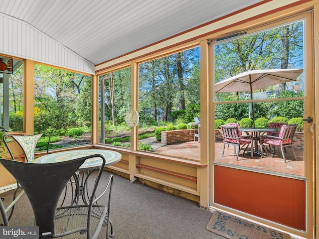 506 Devonshire Ln, Severna Park, MD 21146 - sunroom / solarium with lofted ceiling, outdoor dining area, and view of scattered trees