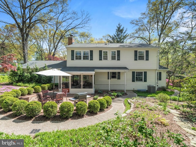 506 Devonshire Ln, Severna Park, MD 21146 - rear view of house featuring a patio area and a chimney