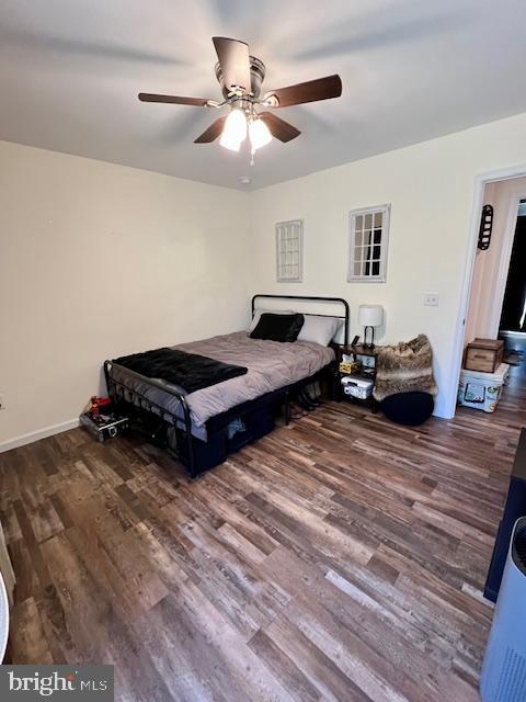 bedroom featuring wood finished floors and ceiling fan