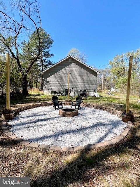 view of property's community with a fire pit