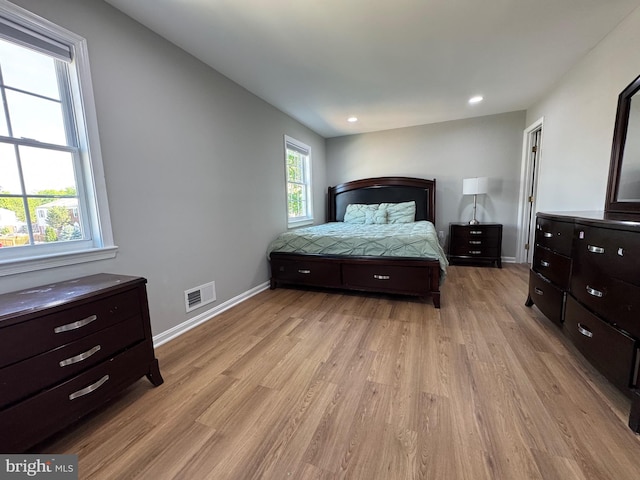 bedroom with recessed lighting, baseboards, visible vents, and light wood-style floors