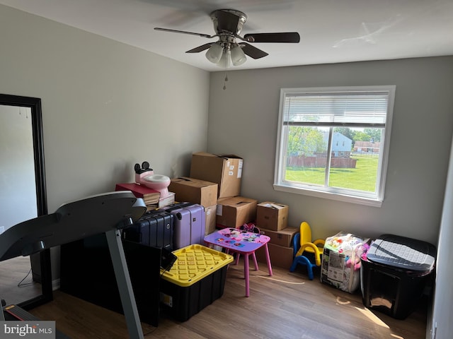 interior space featuring ceiling fan and wood finished floors