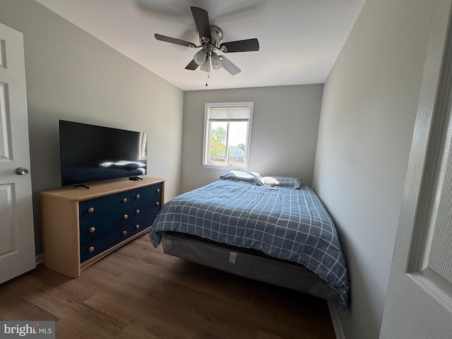 bedroom featuring ceiling fan and dark wood finished floors