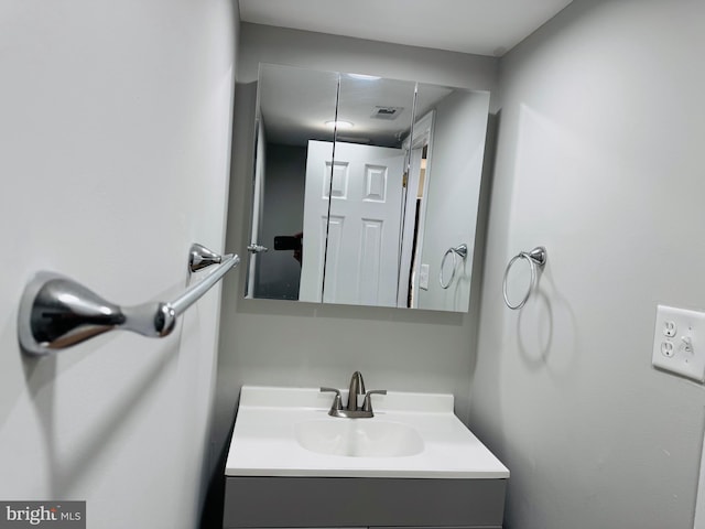 bathroom with visible vents and vanity