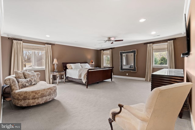 carpeted bedroom with recessed lighting, baseboards, crown molding, and a ceiling fan