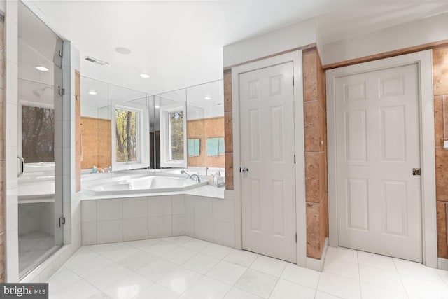 full bathroom featuring a shower stall, tile patterned flooring, visible vents, and a garden tub