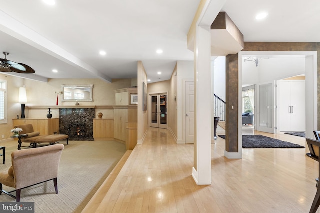 interior space featuring light wood-type flooring, plenty of natural light, recessed lighting, and stairs