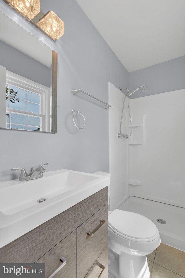 full bathroom with walk in shower, tile patterned flooring, vanity, and toilet