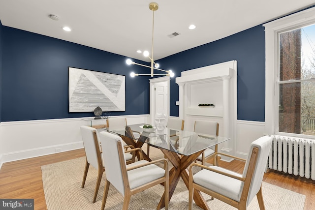 3218 13th St NW, Washington, DC 20010 - dining room featuring wainscoting, visible vents, recessed lighting, radiator heating unit, and wood finished floors