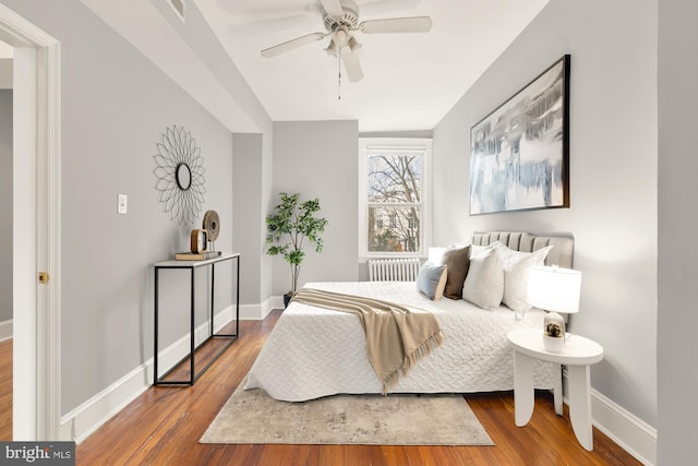 3218 13th St NW, Washington, DC 20010 - bedroom featuring wood finished floors, baseboards, ceiling fan, and radiator