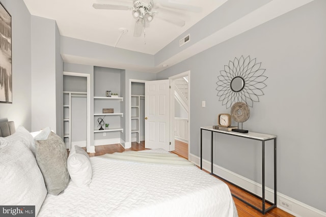 3218 13th St NW, Washington, DC 20010 - bedroom with wood finished floors, visible vents, a ceiling fan, and baseboards