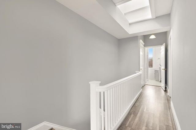 3218 13th St NW, Washington, DC 20010 - hallway featuring wood finished floors, baseboards, and an upstairs landing
