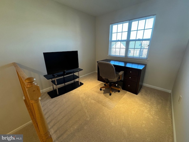 carpeted office with baseboards