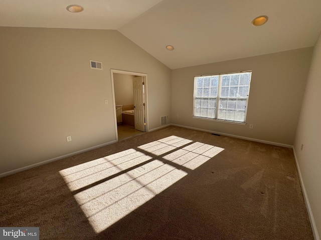 unfurnished bedroom featuring baseboards, lofted ceiling, visible vents, and carpet floors
