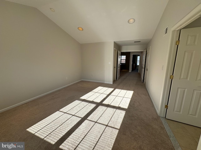 unfurnished room featuring vaulted ceiling, visible vents, recessed lighting, carpet flooring, and baseboards
