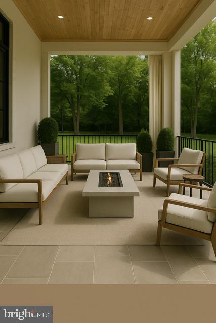 9210 Marseille Dr, Potomac, MD 20854 - view of patio with an outdoor living space with a fire pit