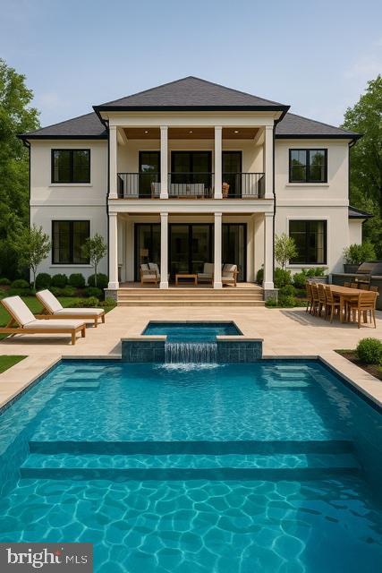 9210 Marseille Dr, Potomac, MD 20854 - back of house with a balcony, a patio area, stucco siding, and outdoor dining area