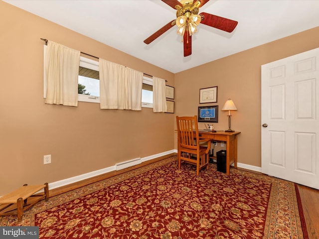 office with baseboards, a ceiling fan, and a baseboard radiator