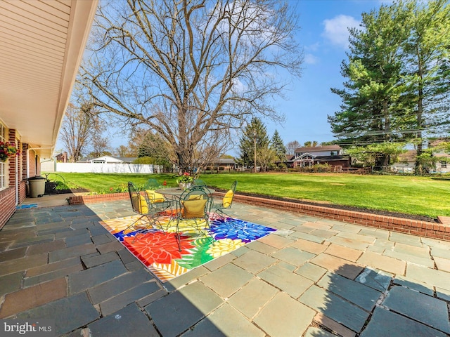 view of patio / terrace with outdoor dining space and fence