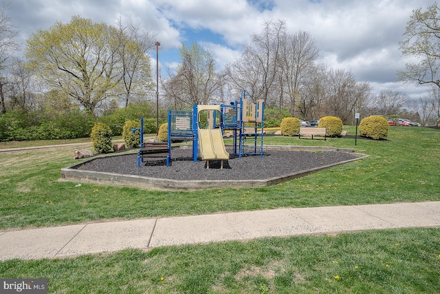 community play area with a lawn