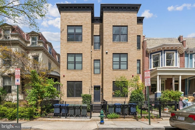1485 Monroe St NW Unit 1, Washington, DC 20010 - view of front facade with brick siding and a fenced front yard
