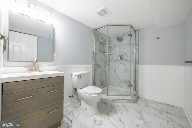 full bath with a marble finish shower, visible vents, a wainscoted wall, and marble finish floor