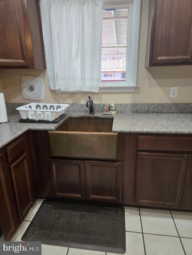 3660 Academy Rd, Philadelphia, PA 19154 - kitchen featuring a sink, light tile patterned floors, and dark brown cabinetry