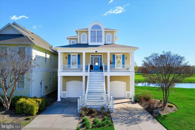 raised beach house featuring a front lawn, a porch, concrete driveway, an attached garage, and stairway