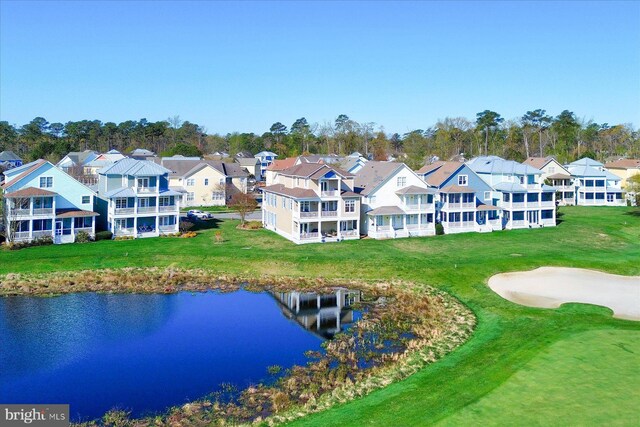 bird's eye view with a water view and a residential view