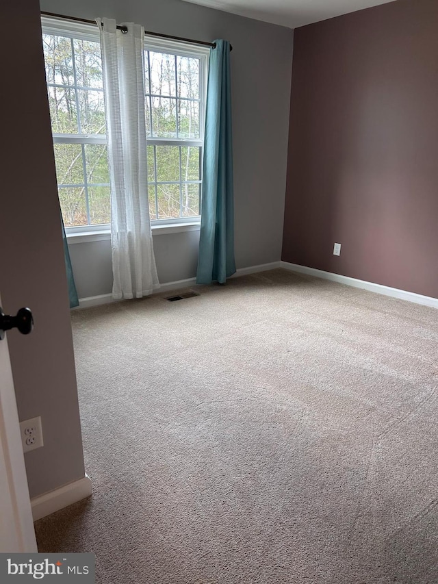 7464 Cedar Fork Rd, Ruther Glen, VA 22546 - carpeted spare room featuring baseboards and visible vents