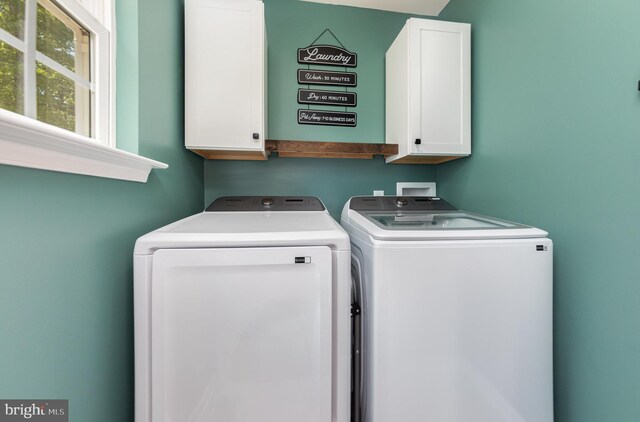 7464 Cedar Fork Rd, Ruther Glen, VA 22546 - laundry area with cabinet space and washing machine and dryer
