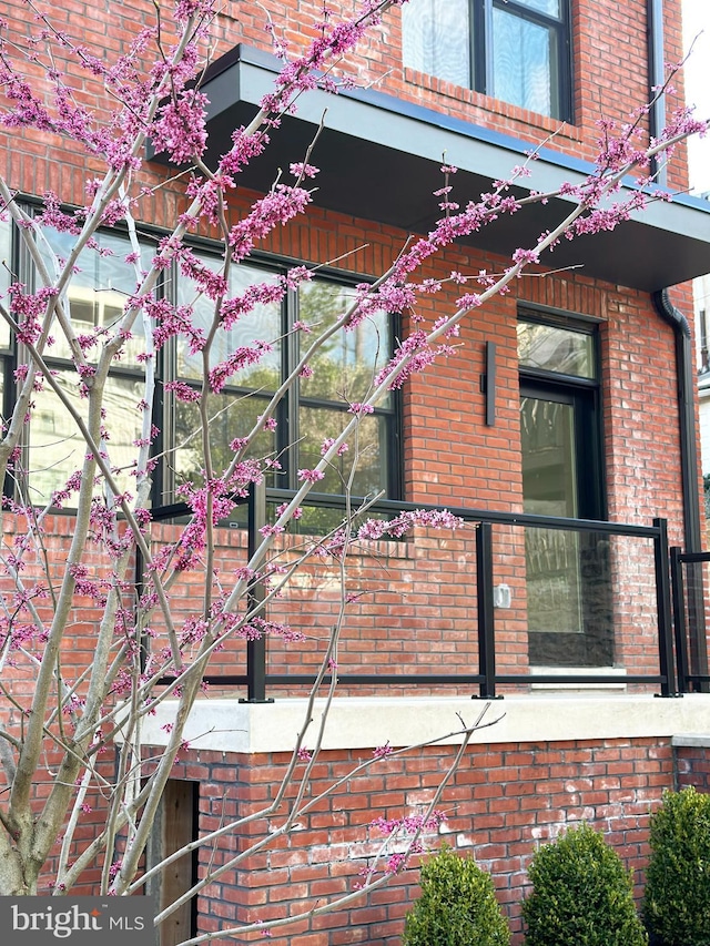 view of property exterior with brick siding