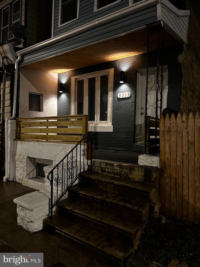 doorway to property with a porch
