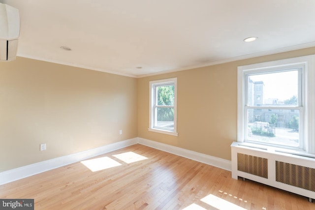 999 N Randolph St, Philadelphia, PA 19123 - spare room featuring baseboards, ornamental molding, recessed lighting, light wood-style floors, and radiator