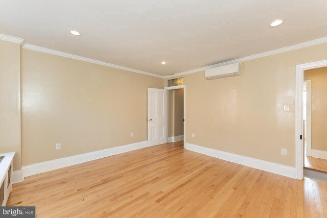 999 N Randolph St, Philadelphia, PA 19123 - spare room with a wall mounted air conditioner, recessed lighting, light wood-type flooring, and crown molding