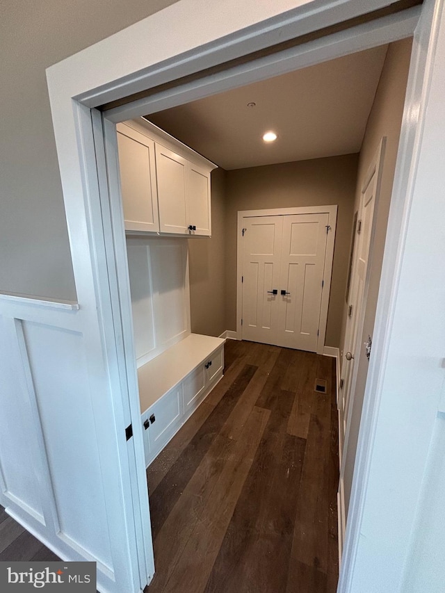 mudroom featuring visible vents, recessed lighting, and dark wood-style floors
