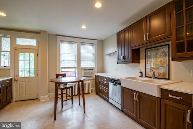 1323 W 41st St, Baltimore, MD 21211 - kitchen featuring stainless steel dishwasher, radiator heating unit, light countertops, glass insert cabinets, and recessed lighting